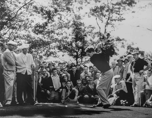 Burke Jr. swings away as Hogan watches